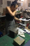 Christiane Campioni in sensitive action creating unique pieces of art and jewelry using all sorts of techniques from her practice as art conservator.