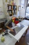 Christiane Campioni in action using liquid metal and natural leaves as inlay.